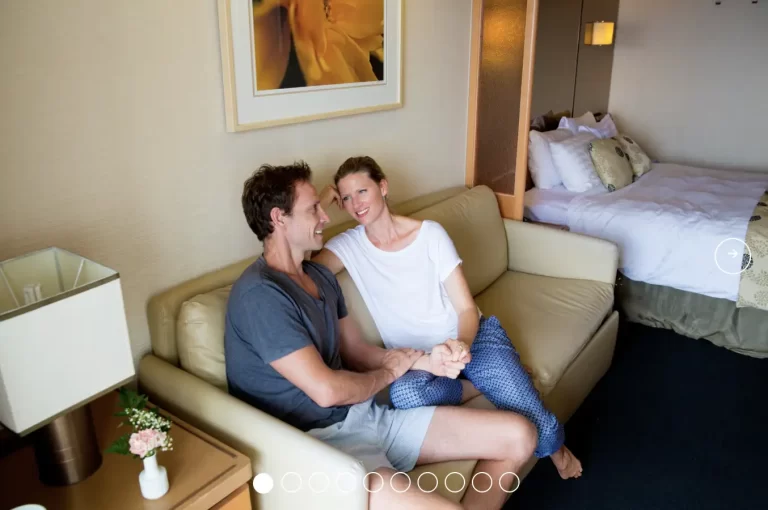 PACIFIC EXPLORER Balcony view couple on couch