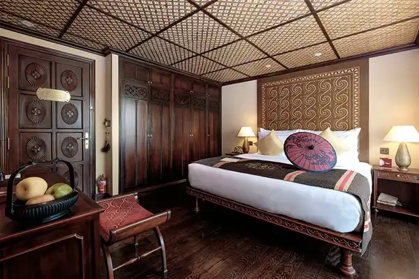 Heritage Line-Myanmar-ship anawrahta_accommodation-Deluxe Staterooms-double bed wood panels Heritage Line-Myanmar-ship anawrahta_accommodation-Deluxe Staterooms-double bed wood panels