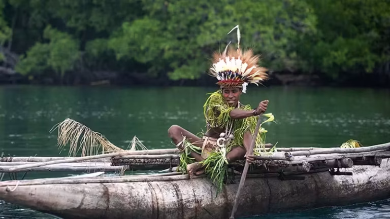 PNG man in canoe